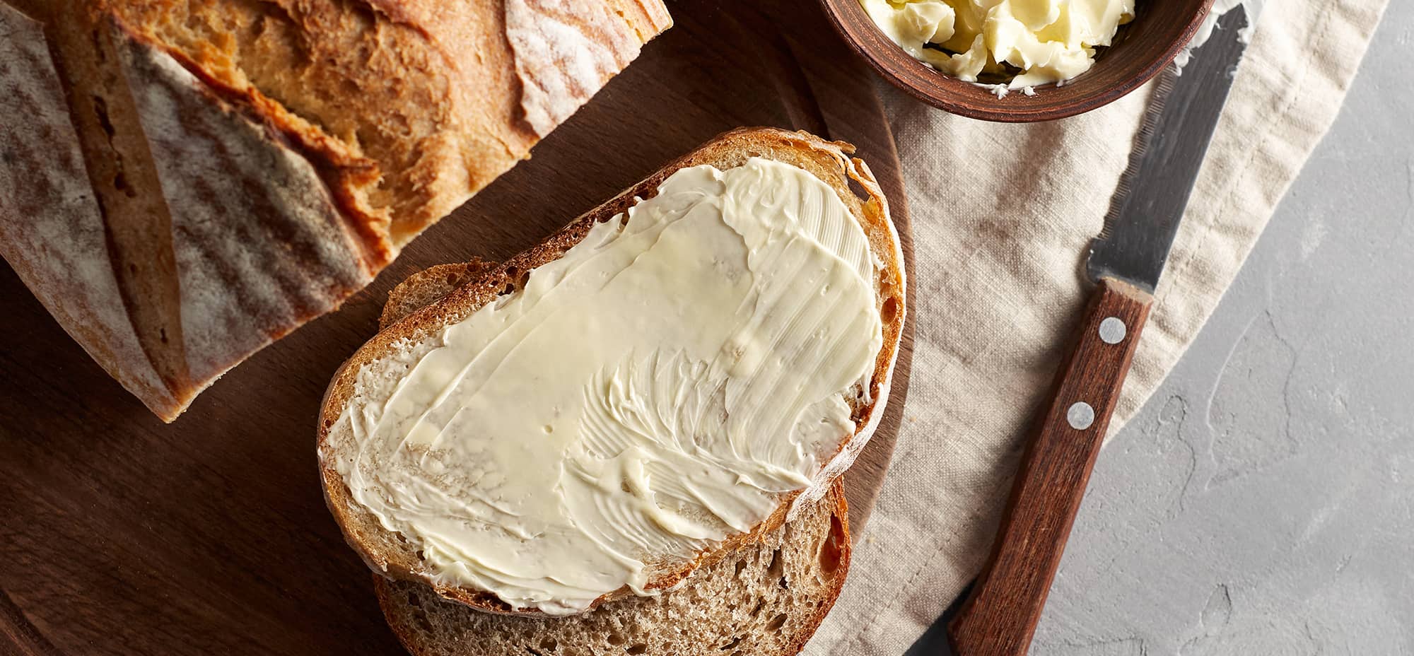 Image of a piece of toast with a layer of butter